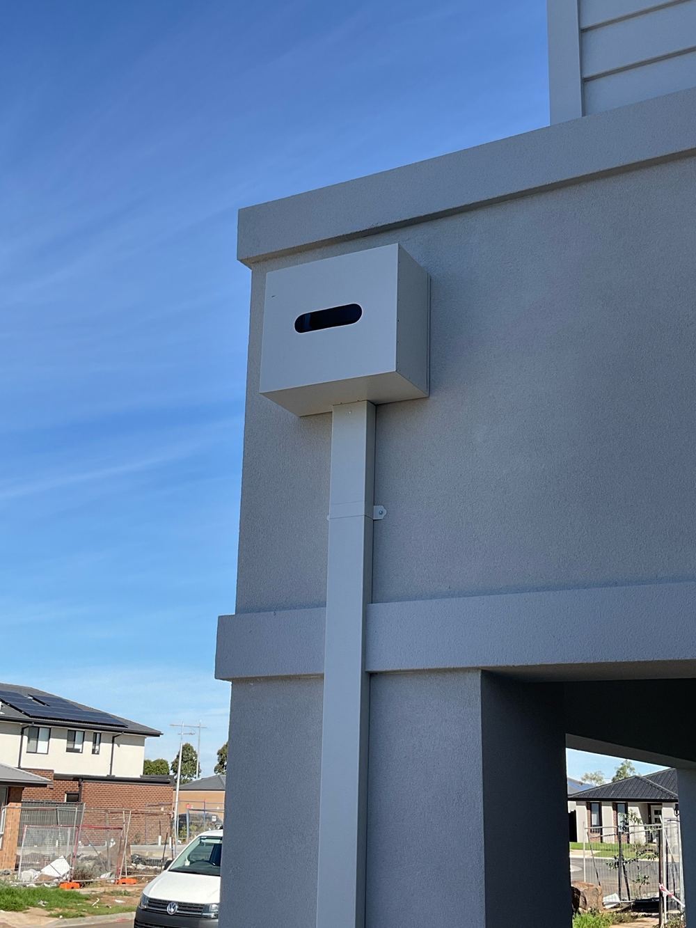 Box gutter rainhead fitted with overflow slots that are no longer permitted, found during a pre-handover inspection in Werribee