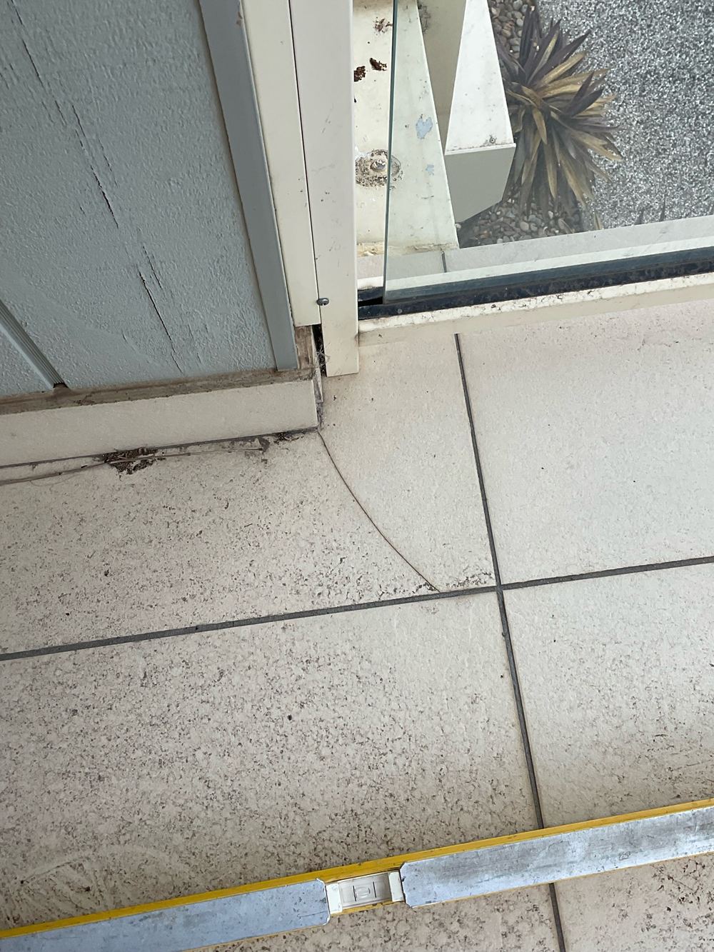 Cracked balcony tiles that can let water reach the structure below, found during a pre-purchase inspection in Sunshine North