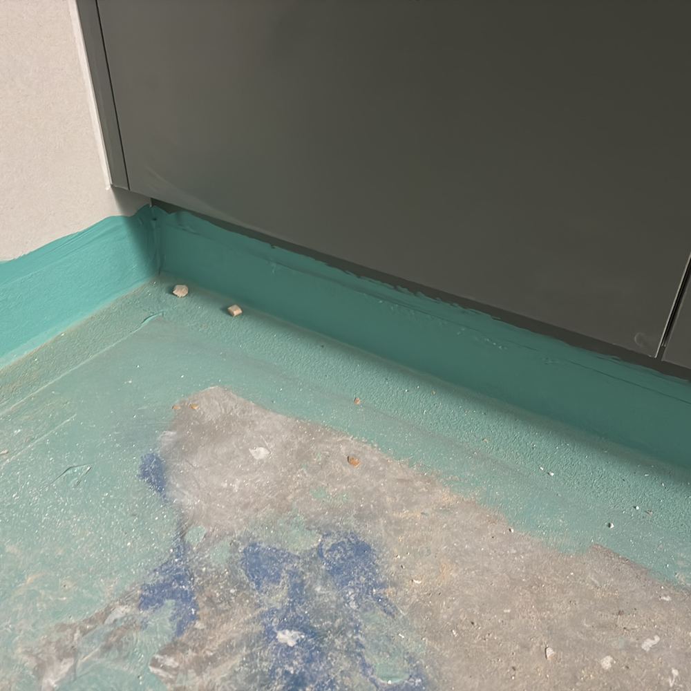 No confirmation that waterproofing runs behind the bathroom cabinets, found during a waterproofing inspection in Werribee